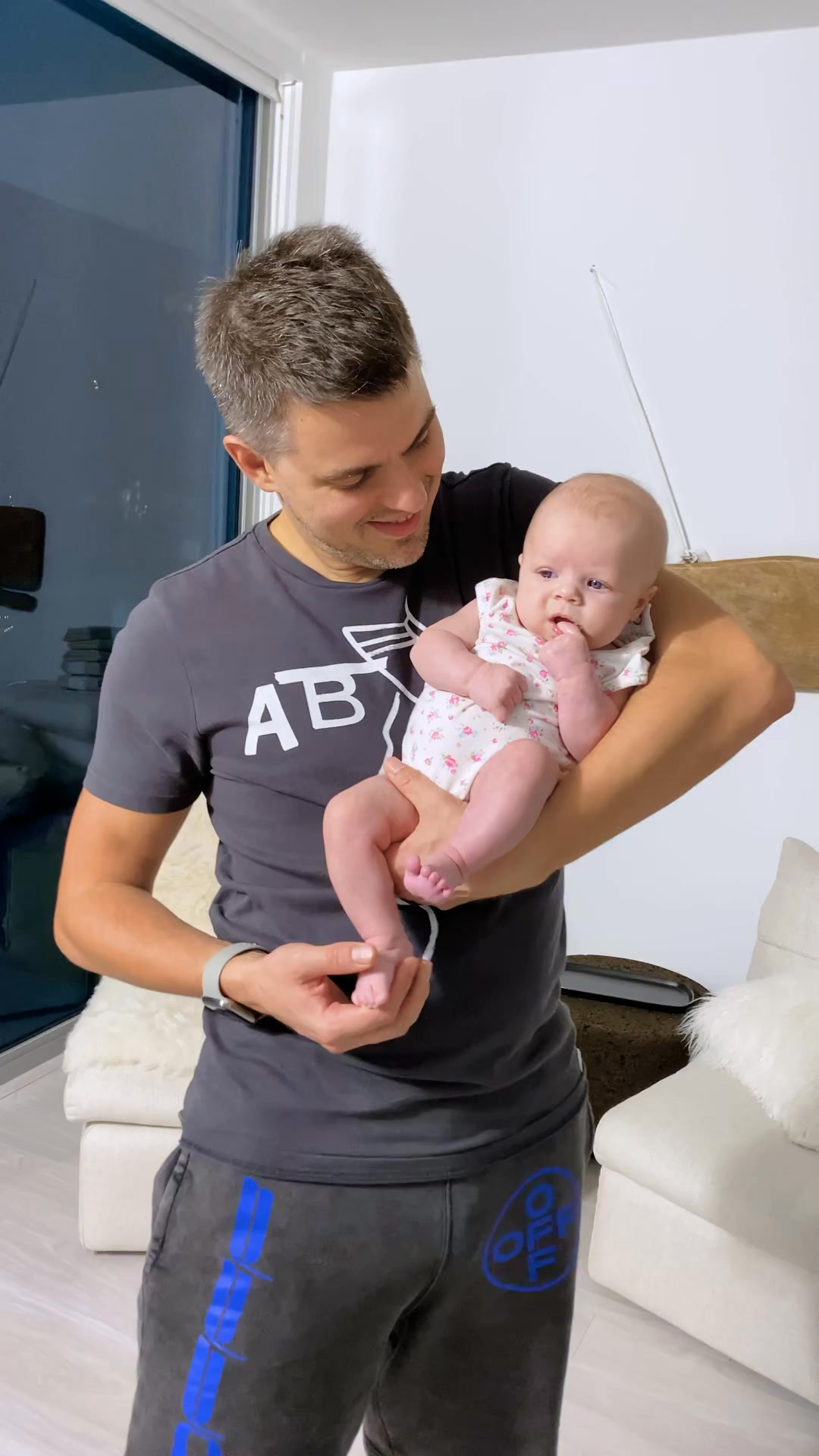 Dad is holding baby Naomi. Cute Baby Reel! | Naomi Life | Facebook