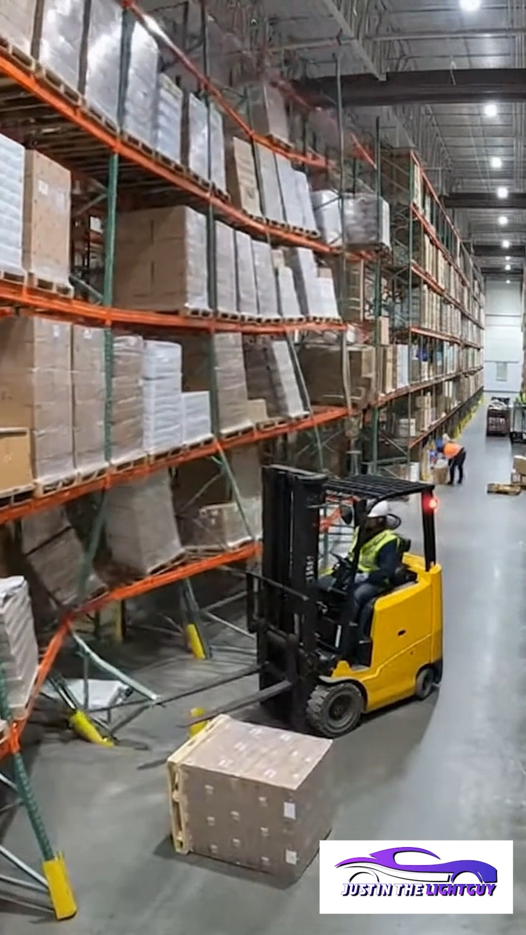 A forklift strikes a storage rack, causing a collapse. Falling boxes ...