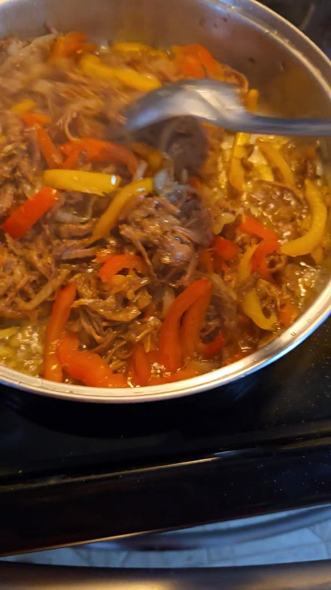 I am cooking steak hogie filling with garlic, sliced onions, sliced ...