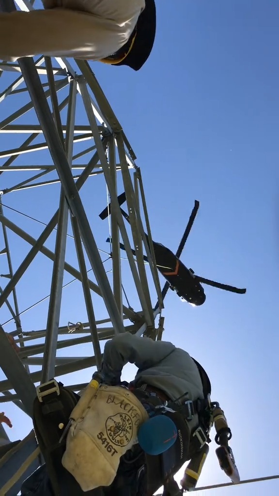 Lineman assisting tower crew in some maintenance Credits TT collitexhxs ...