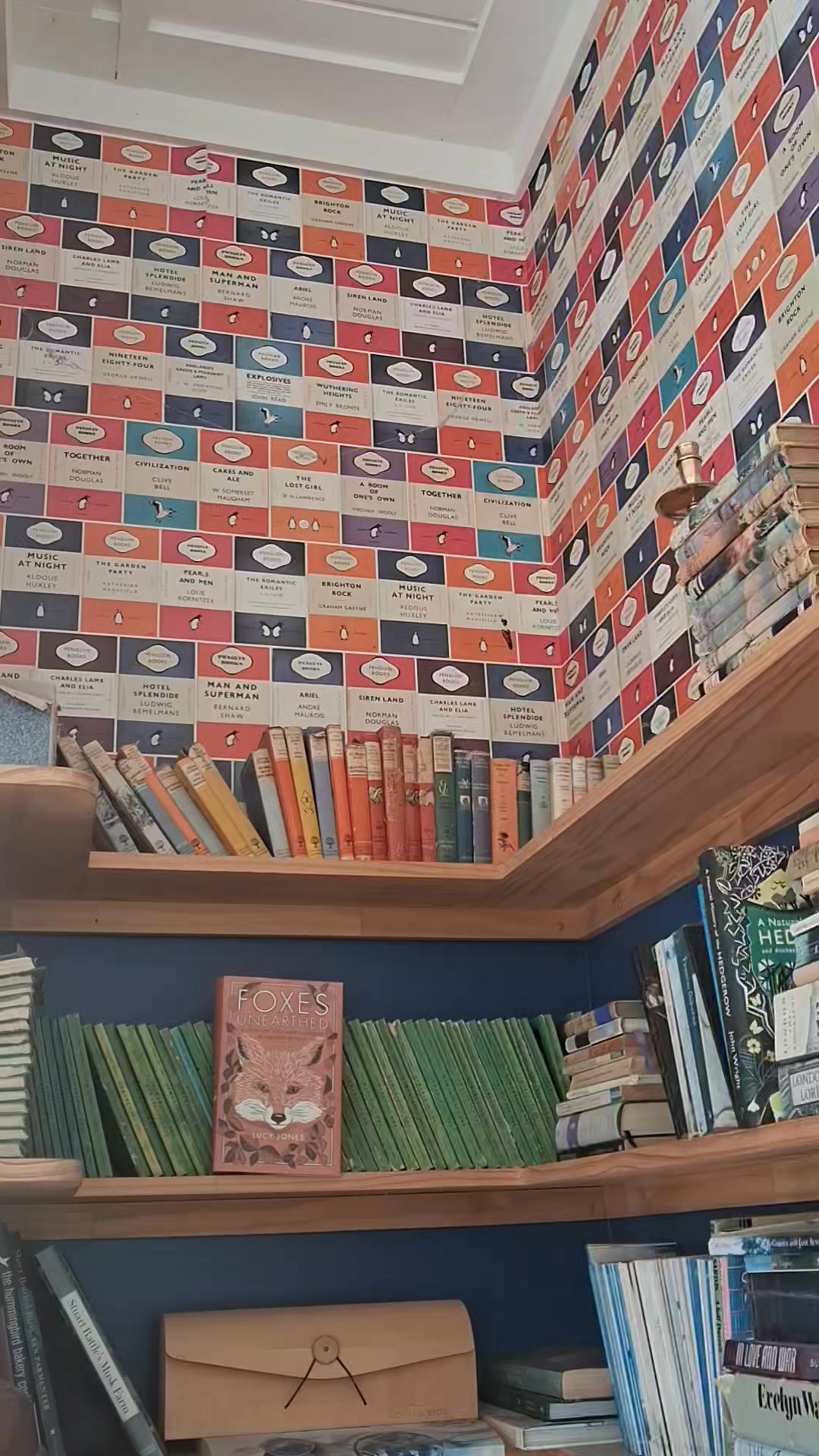 Cozy holiday home library with Penguin book wallpaper