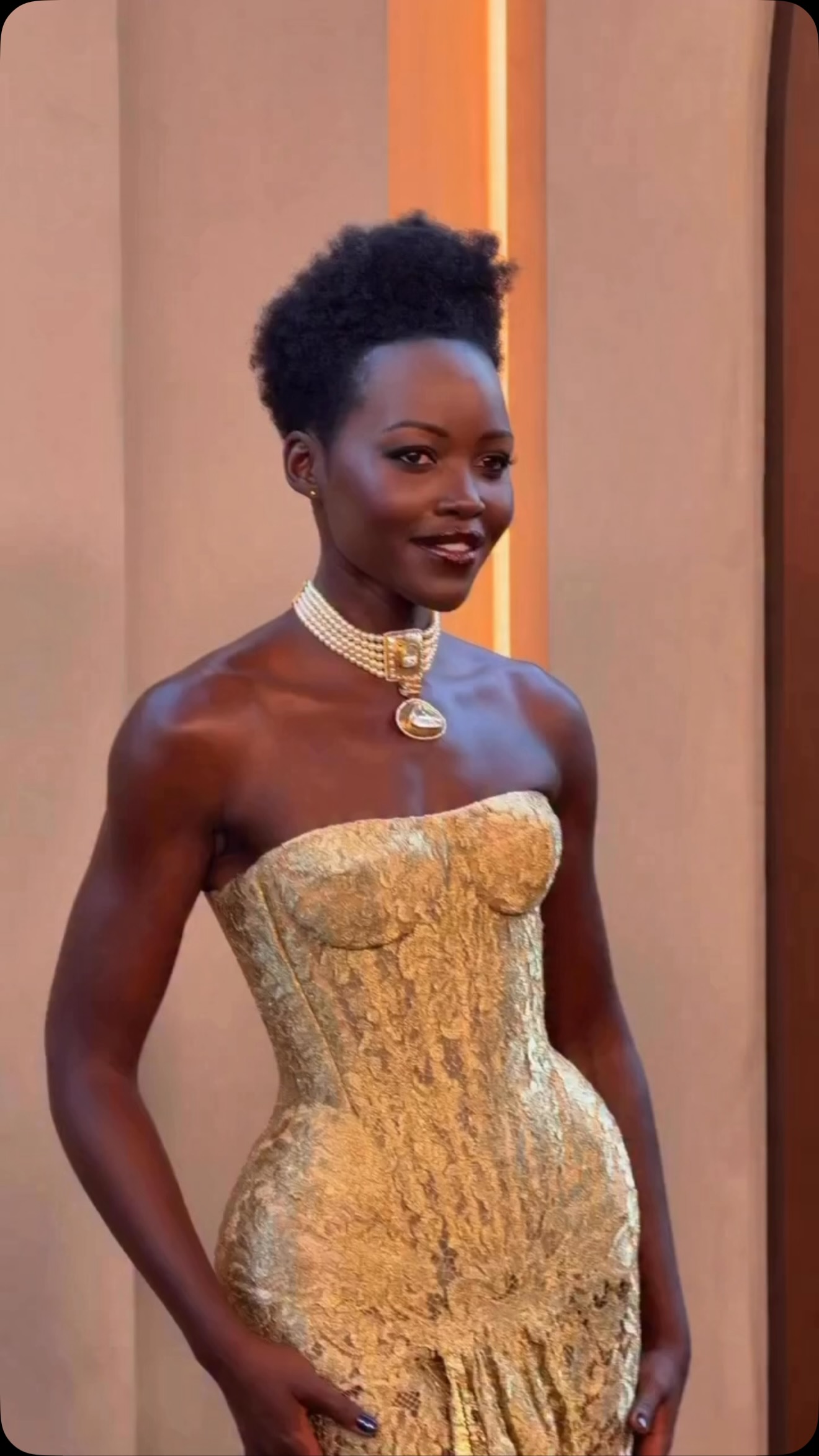 new look gold dress Radiating elegance from every angle, @lupitanyongo attended The Odyssey York premiere in a custom lace strapless gown by @nicholasoakwellcoutureofficial. She completed the with an full-length evening gown