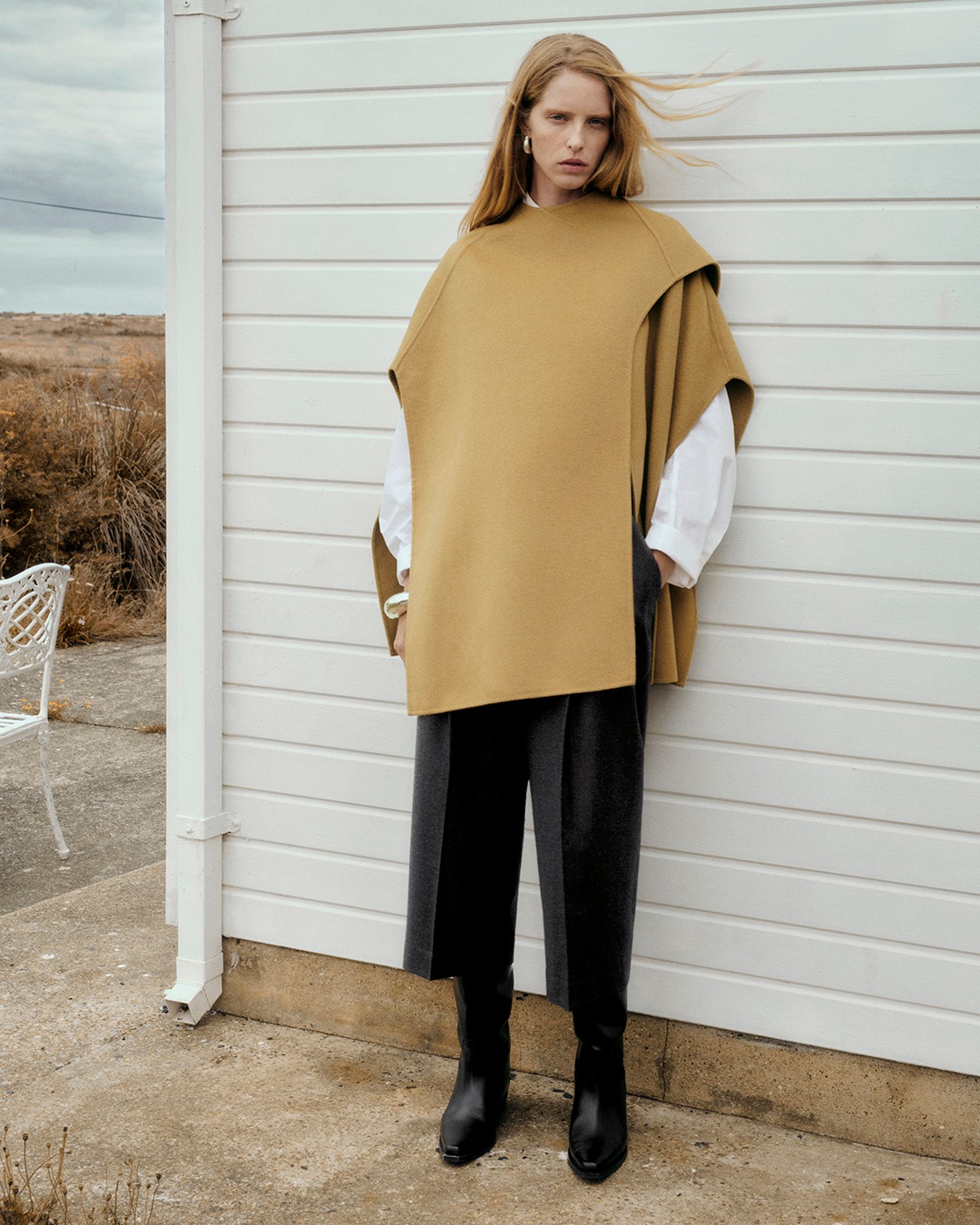 AW23 Outerwear Collection​ The wool-blend cape​ Discover the