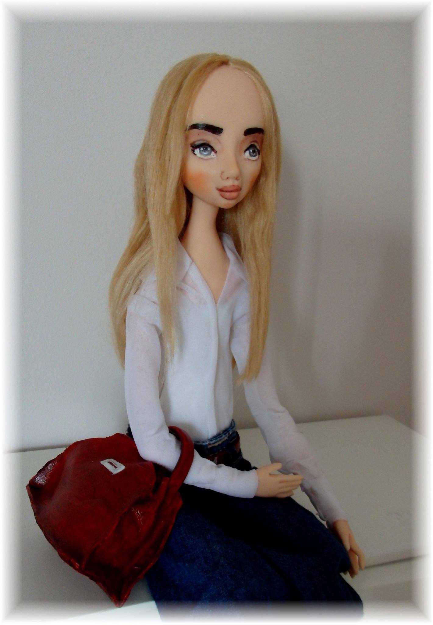 Adorable handmade OOAK doll with curious expression unveiled