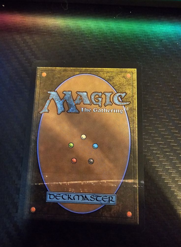 Is non-foil Burnt Offering card ultra rare or a misprint?
