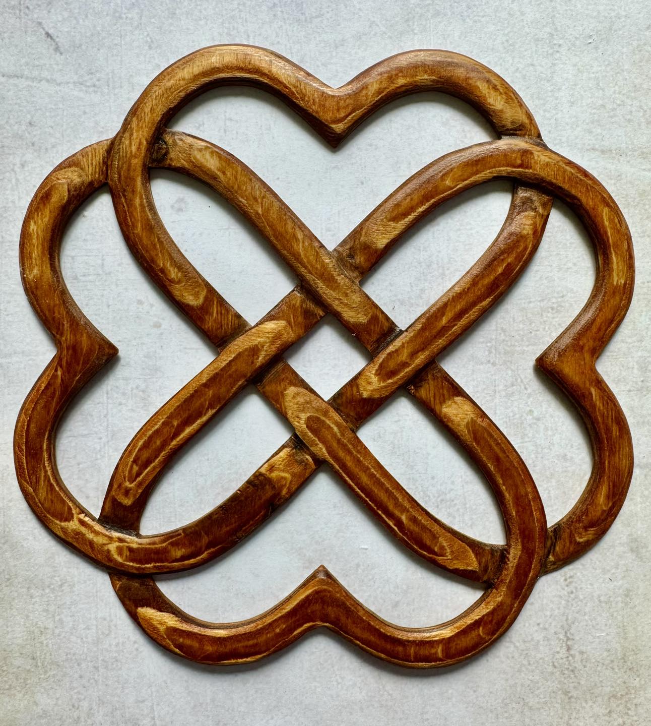 The Celtic knotwork of this pendant traces out a subtle heart 
