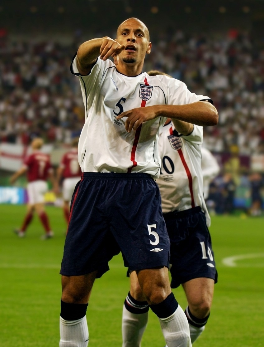 JUNE 15, 2002. Rio Ferdinand of England celebrates scoring the