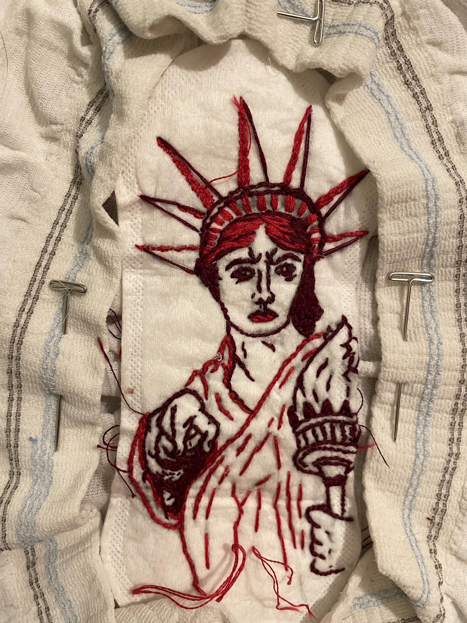 Is embroidered menstrual product art considered fine craft?