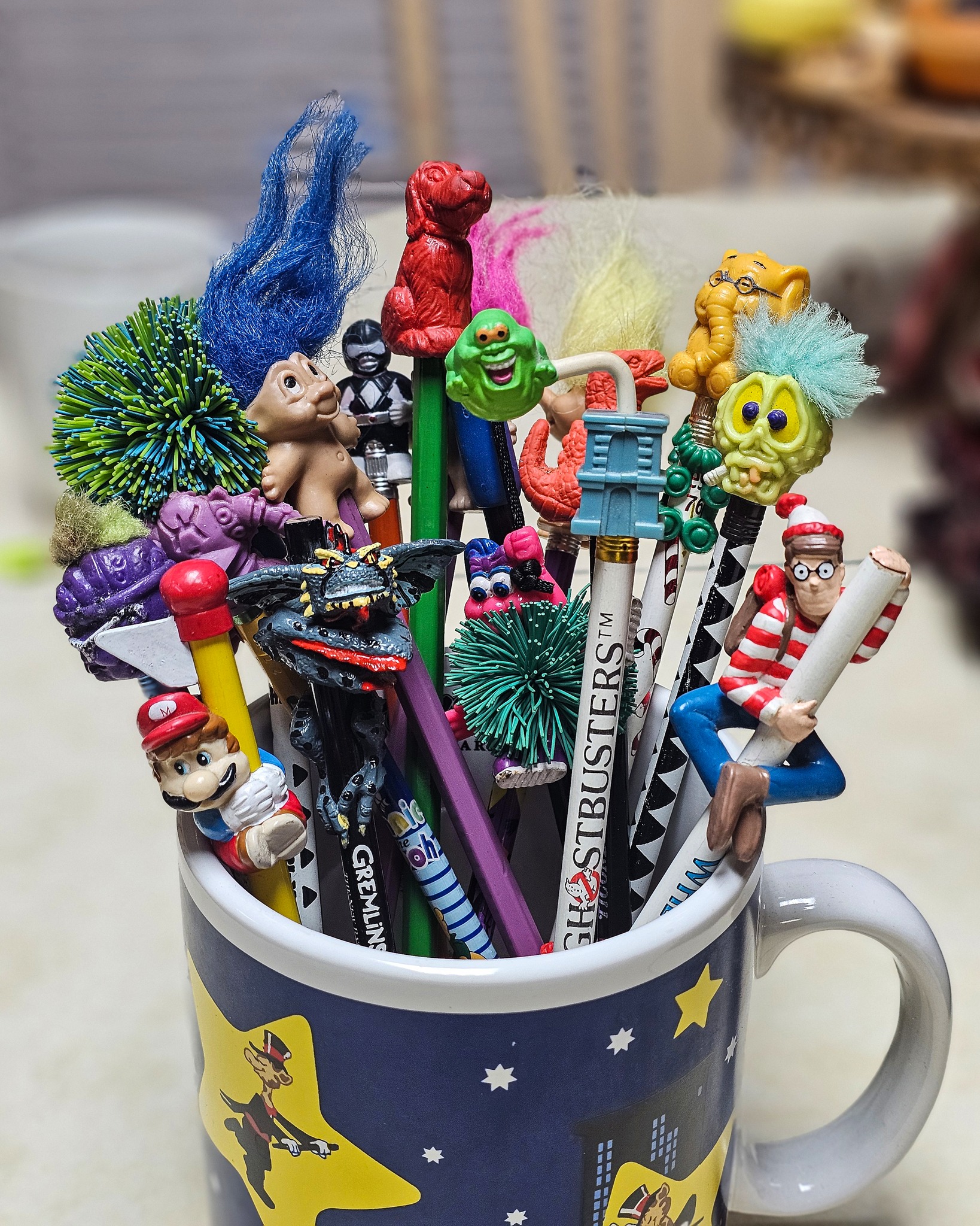 A painting of a toy rubber monster pencil topper or finger puppet 
