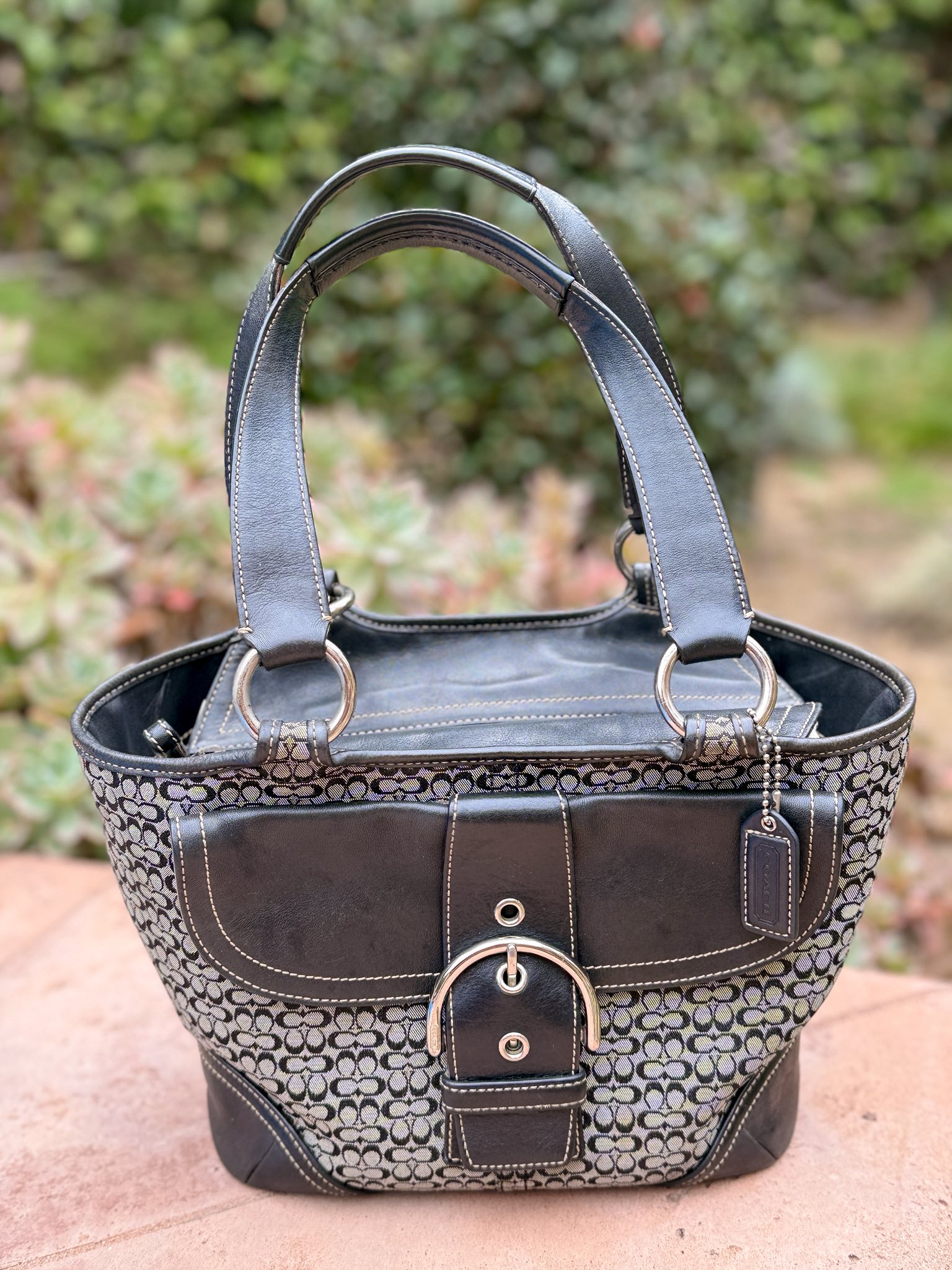 Carrying my 2004 black leather Soho flap bag today