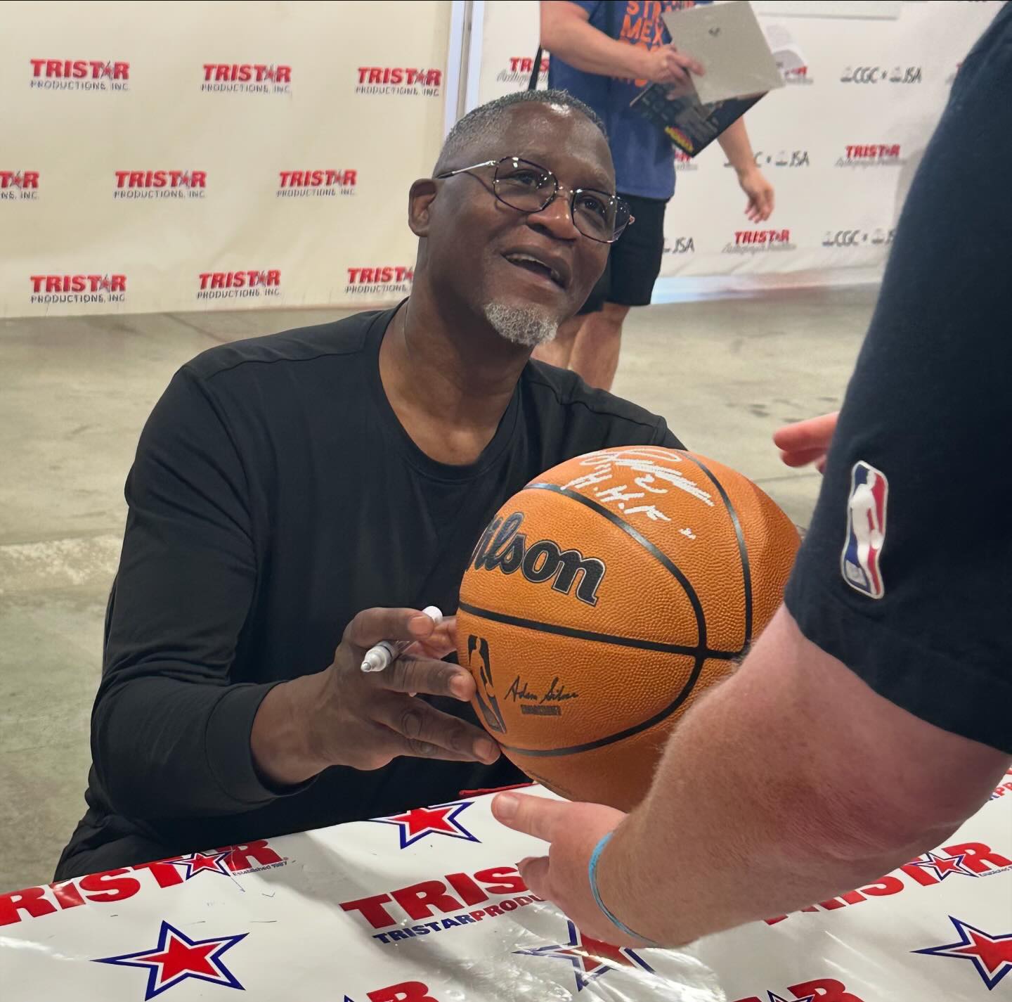 NBA great Dominique Wilkins signs autographs at The National in 