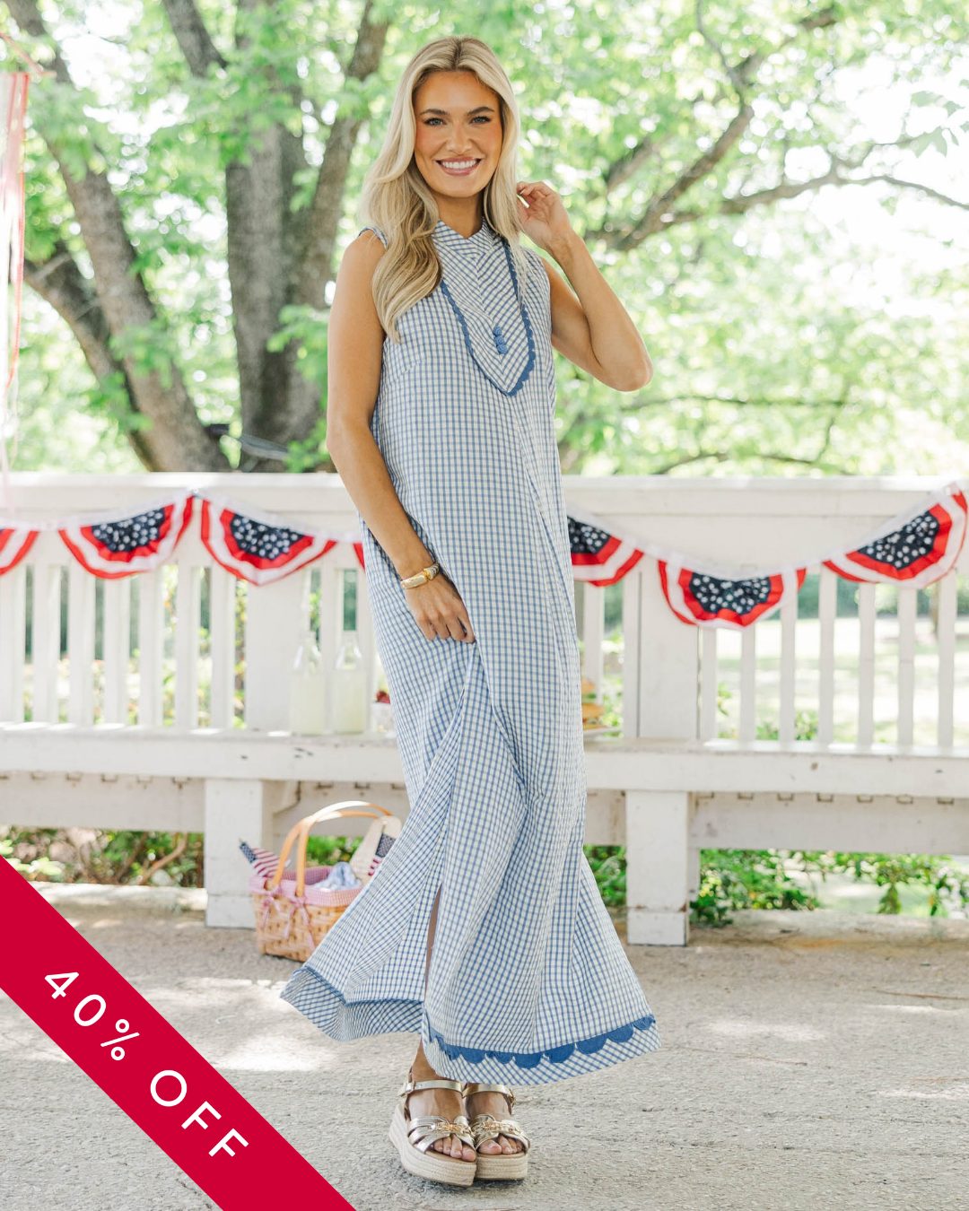 Your Fourth of July dress just got even better ❤️🤍💙 This blue gingham midi is the kind of style you'll reach for all summer long—and right now, it's 40% off. Grab yours