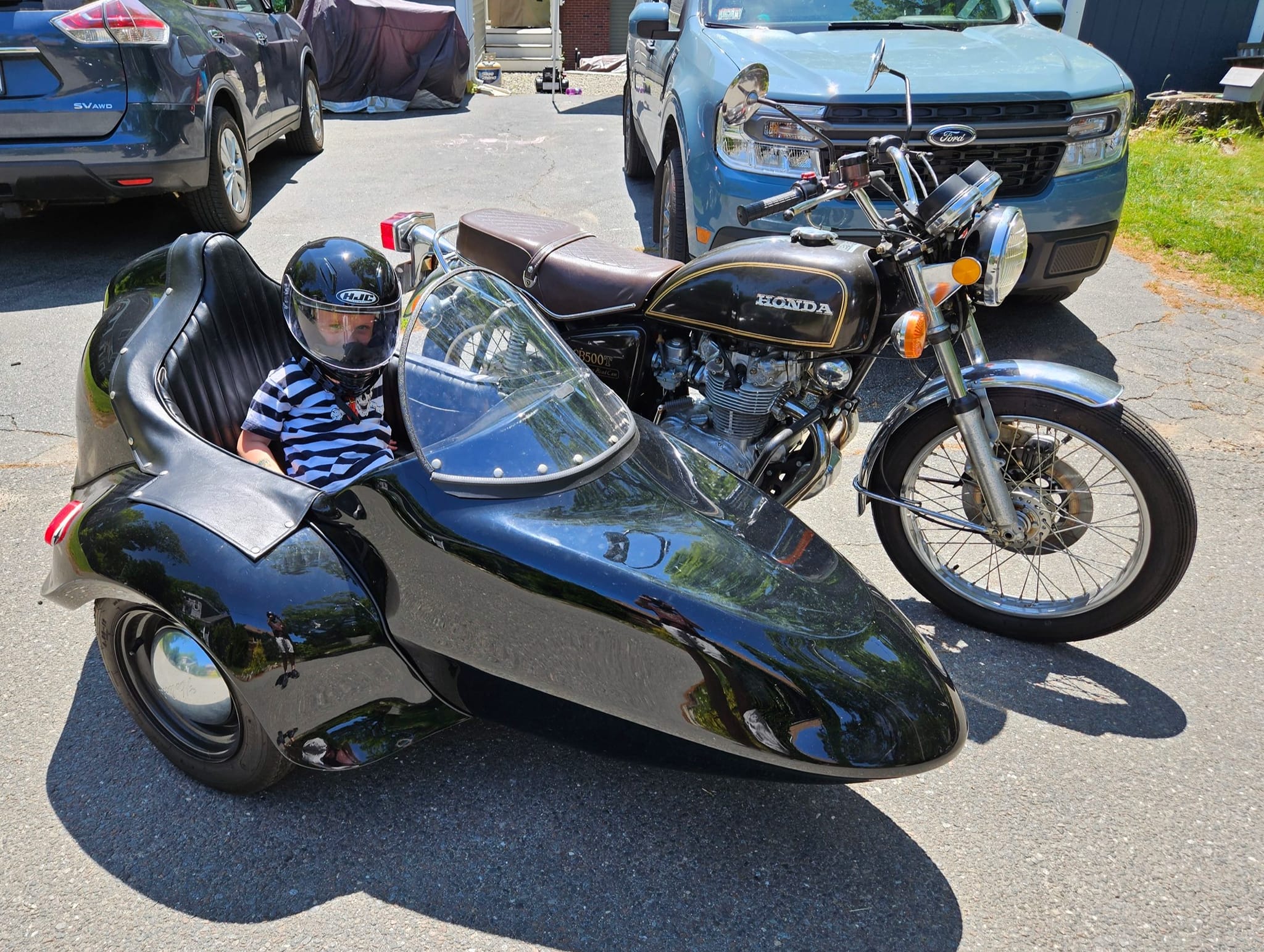 Riding a 1975 CB500T motorcycle with son