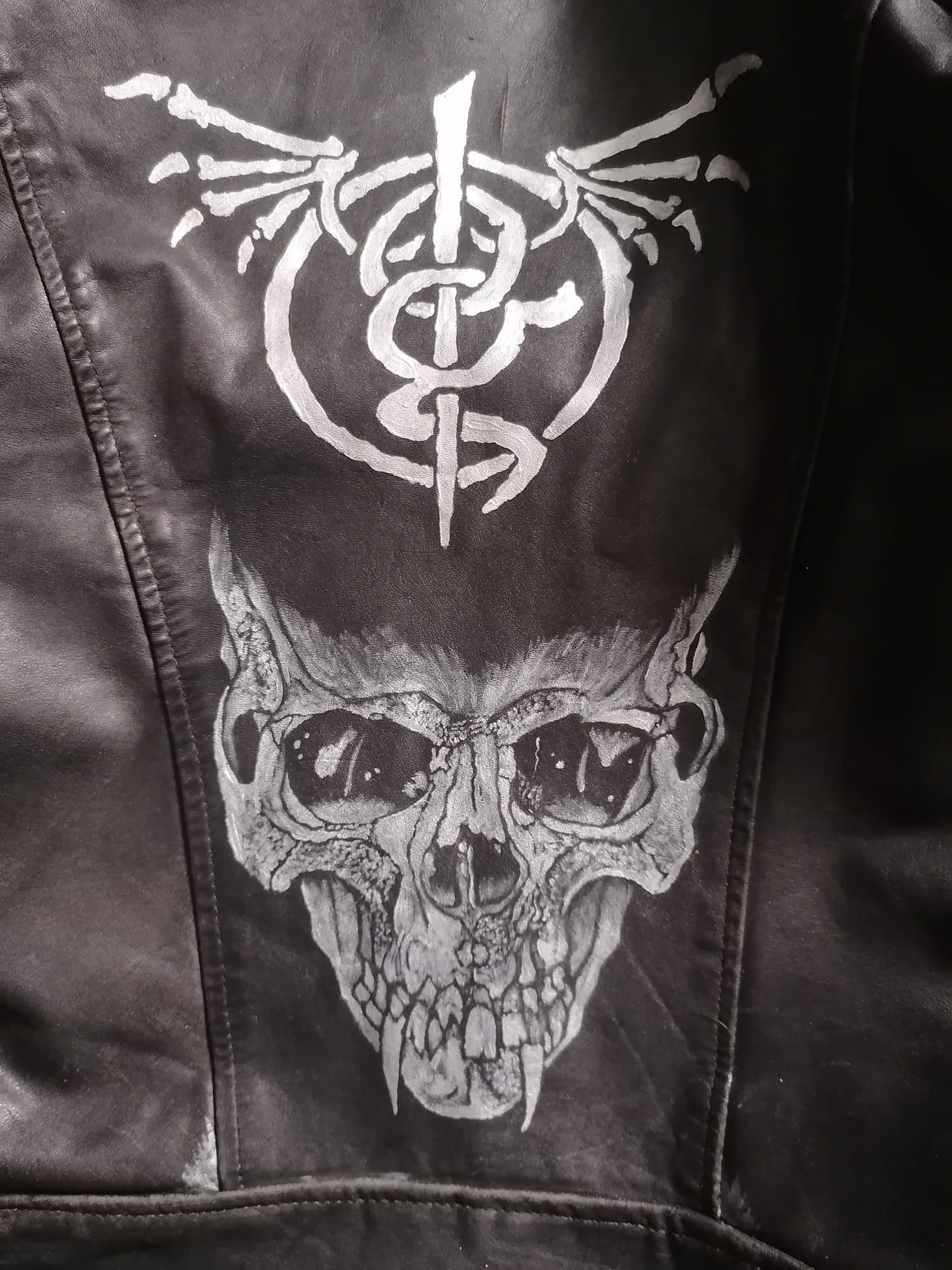 Pushead-inspired skull painting on leather jacket