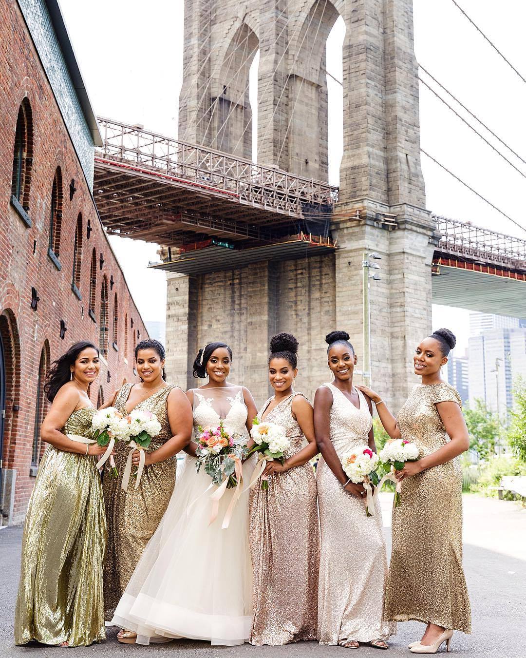 This bride wore a Lazaro wedding dress and her bridesmaids sparkled in gold!