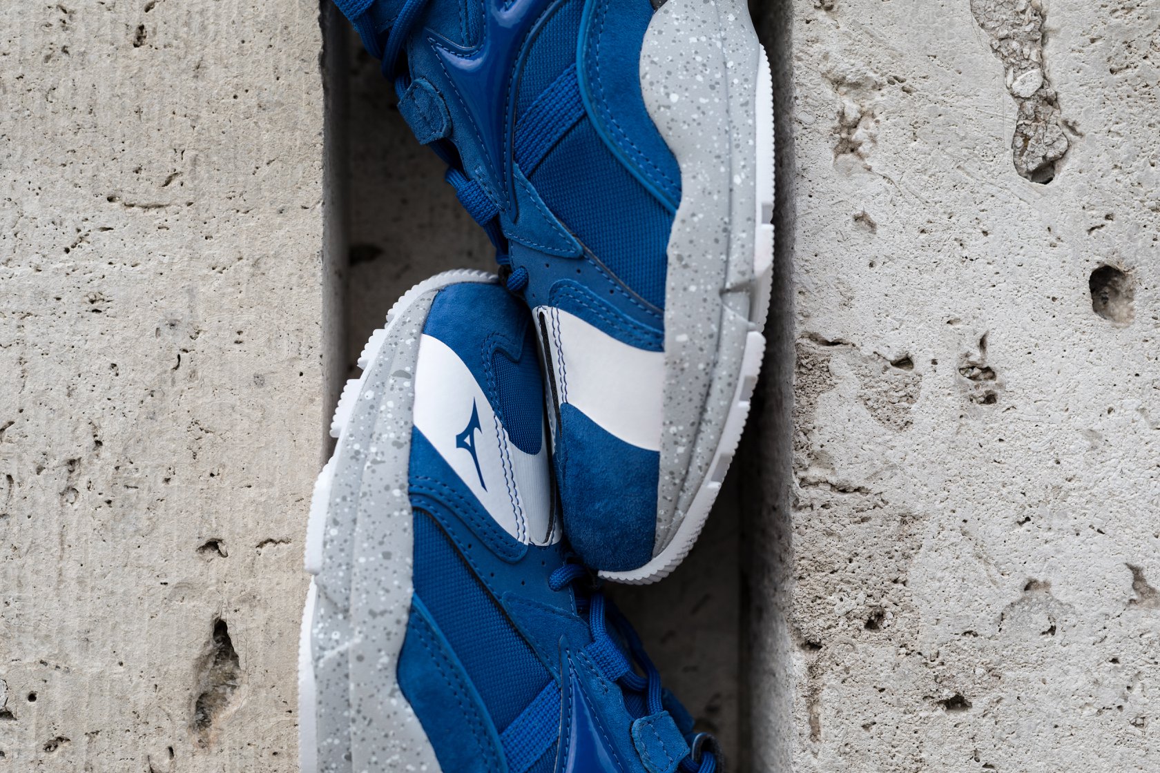 Japanese retailer mita sneakers and Mizuno linked up on this