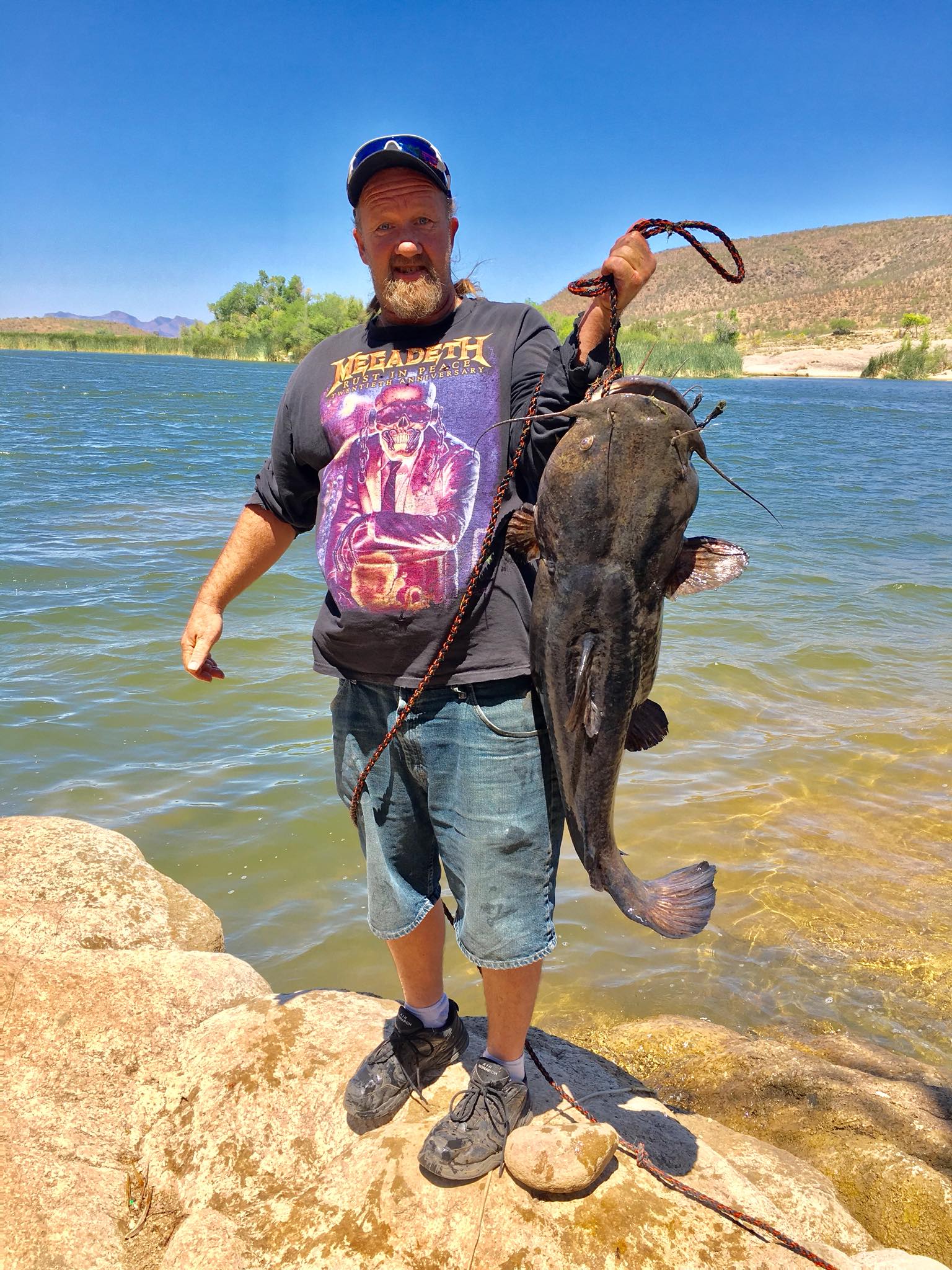 WHAT A CATCH! This man reeled in a catfish weighing 32.8 pounds at