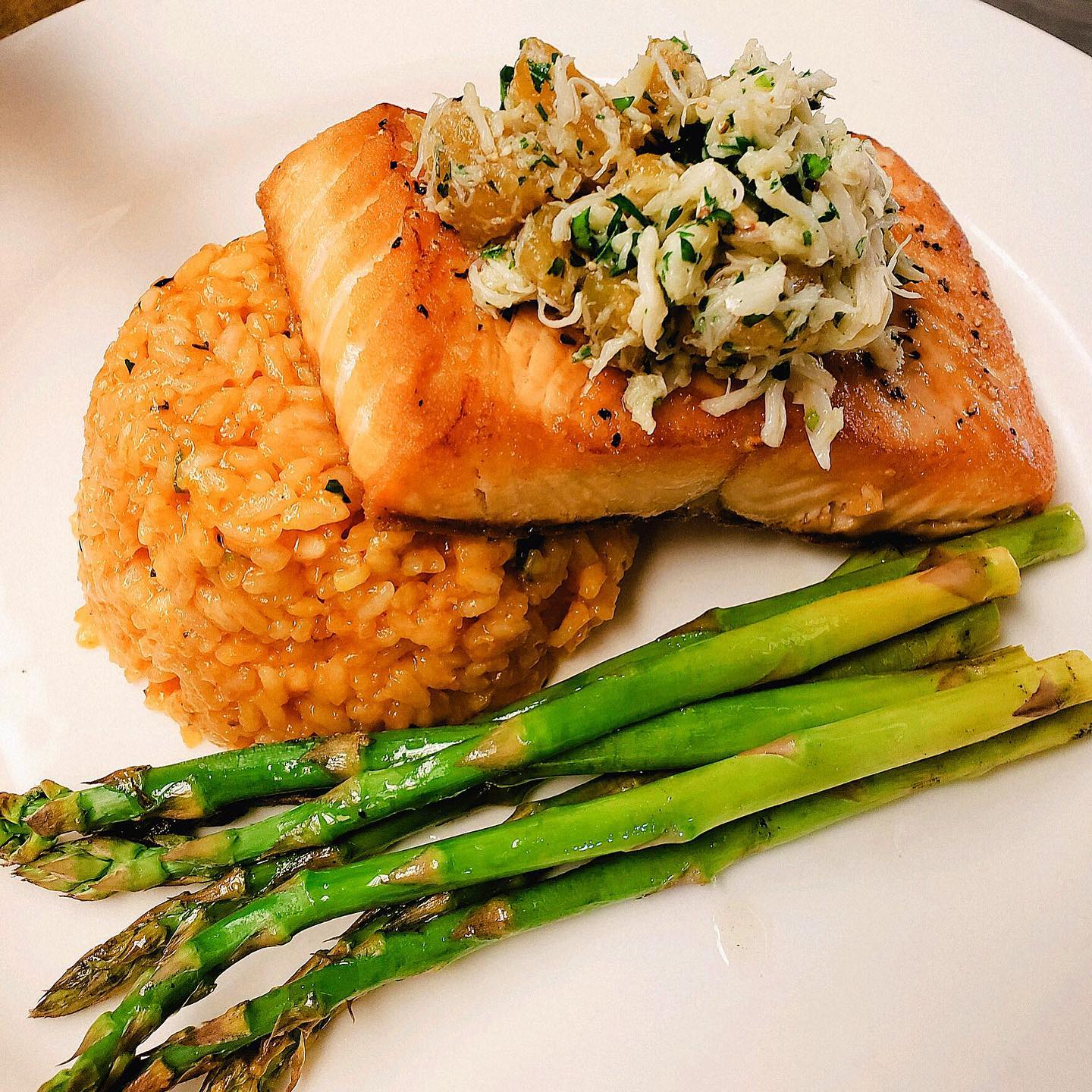 The Captain - Seared salmon topped with with blue crab and caramelized ...