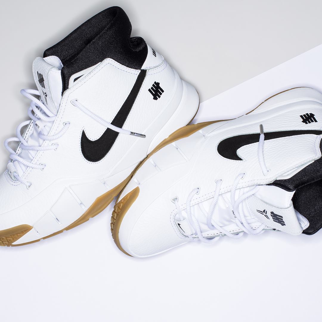 UNDEFEATED x NIKE ZOOM KOBE 1 PROTRO “WHITE/GUM” . . Featuring a