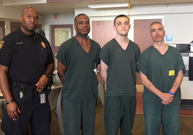 Gwinnett - These are the faces of four heroes. One wears the uniform of ...