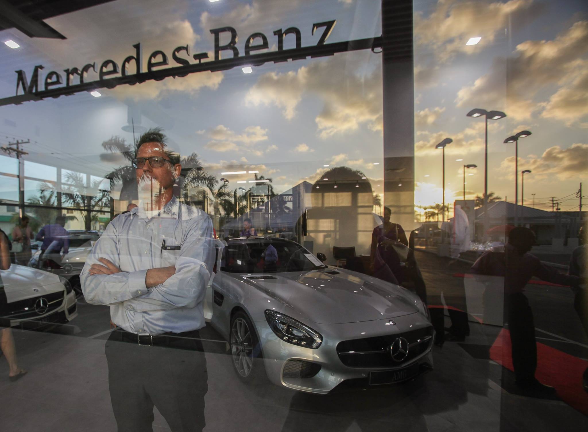 Cayman - John Michael Foster in the new Car City Cayman show room and ...