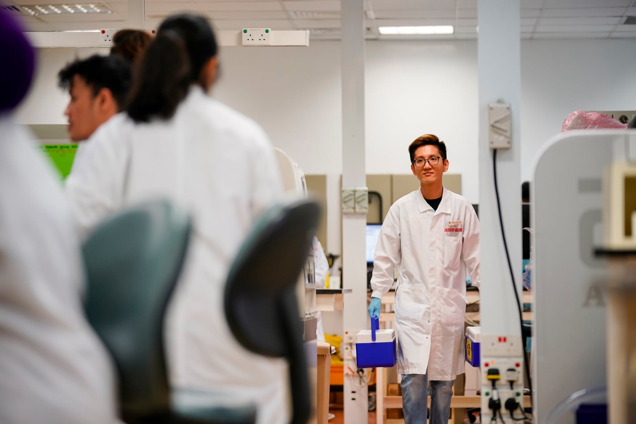 National University Hospital - NUH - A staff in Lab Med taking the ...