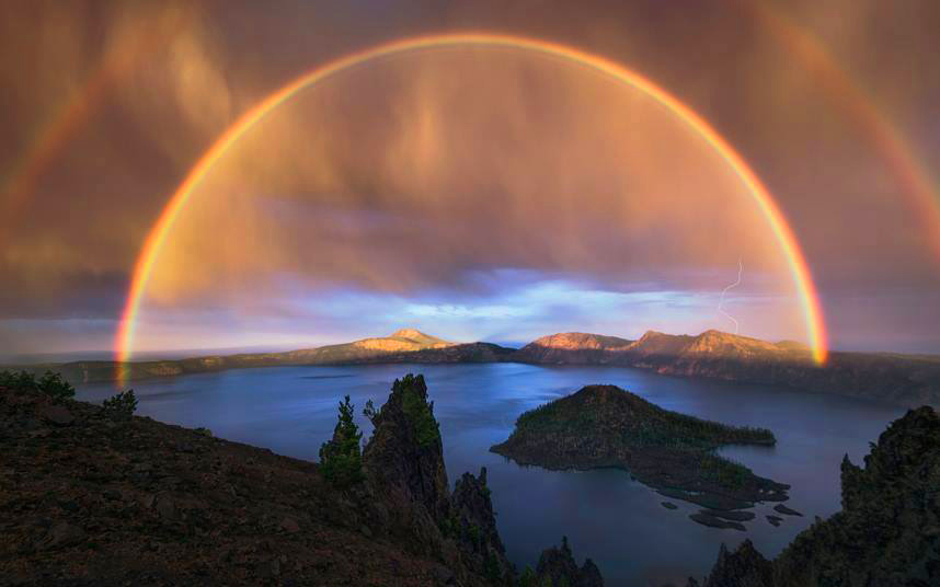 Five mile wide double rainbow during a thunderstorm at Crater Lake