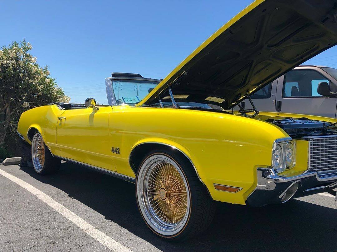 Vogue - One of the best! Yellow Oldsmobile Convertible Cutlass 442