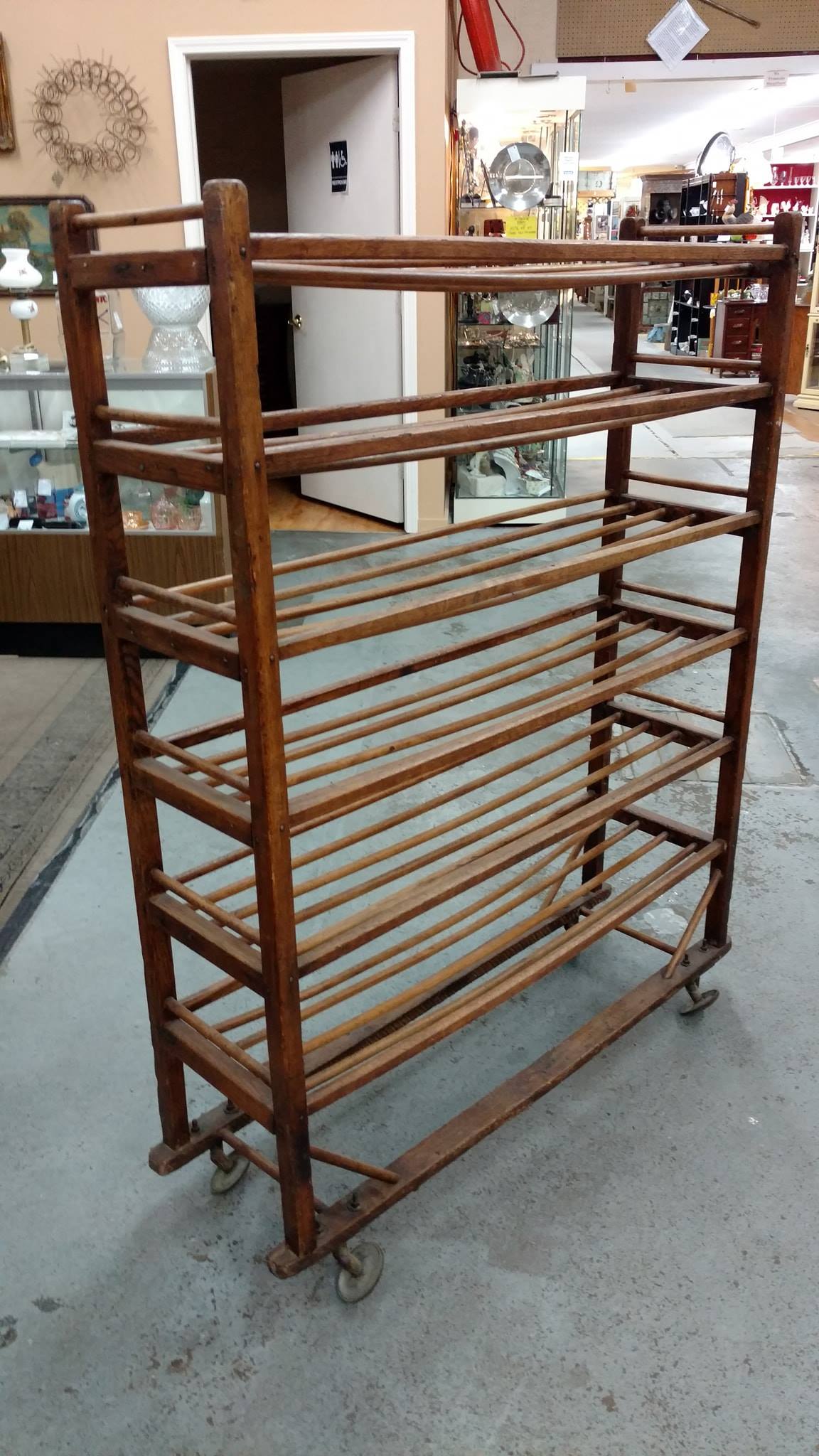 This is an antique collapsible drying rack from the 1920 era. Made