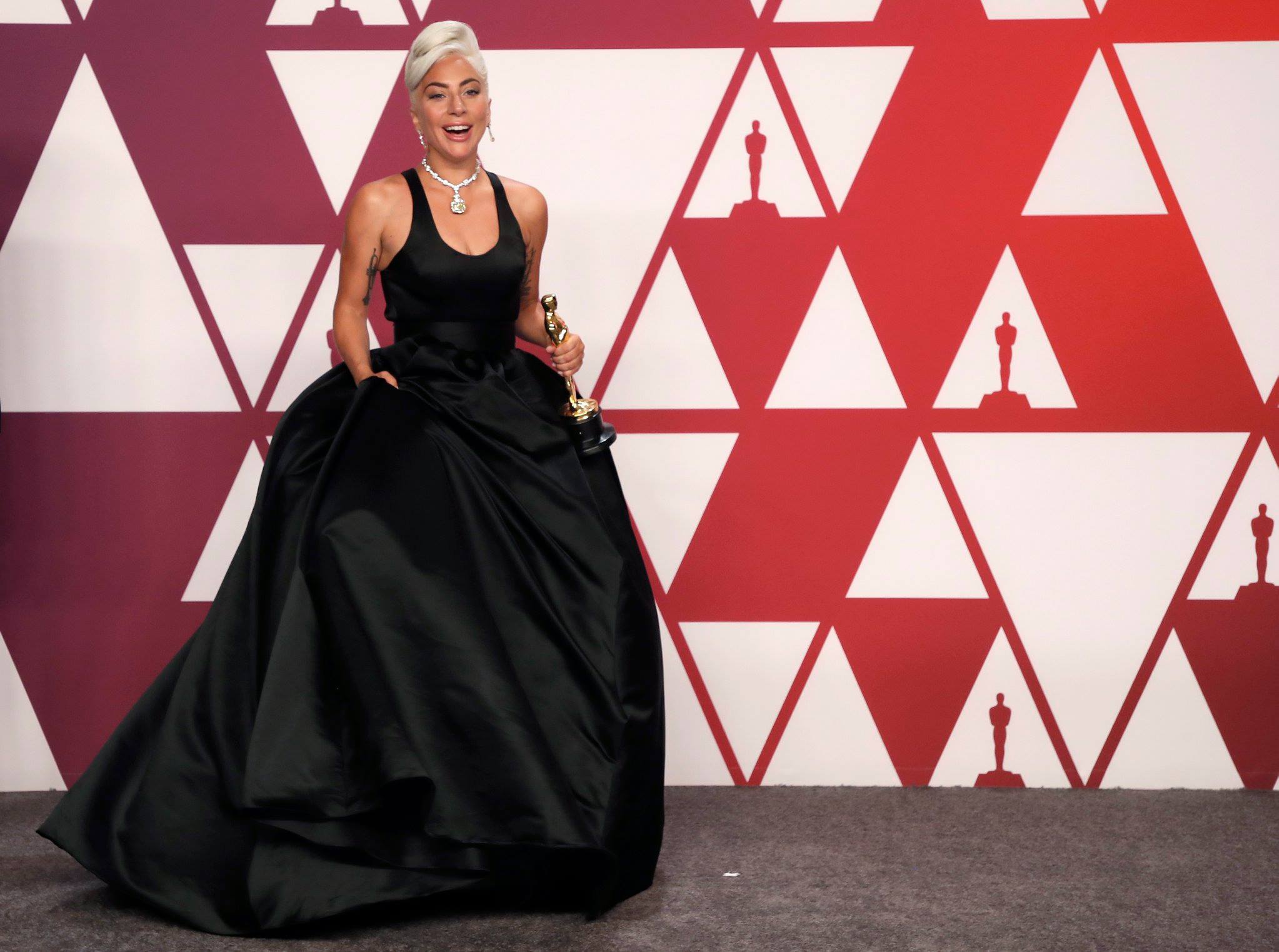 lady gaga triangle dress A star is sparkling! shines in Audrey Hepburn's $30m Breakfast At Tiffany's diamond as she joined best dressed silver sirens Jennifer Lopez and Brie Larson on the Oscars red carpet. # spartina