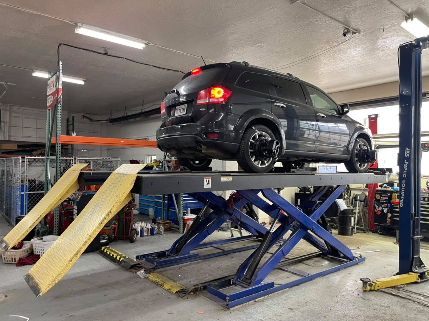 Our alignment rack accommodates... - Fat Bob's Garage