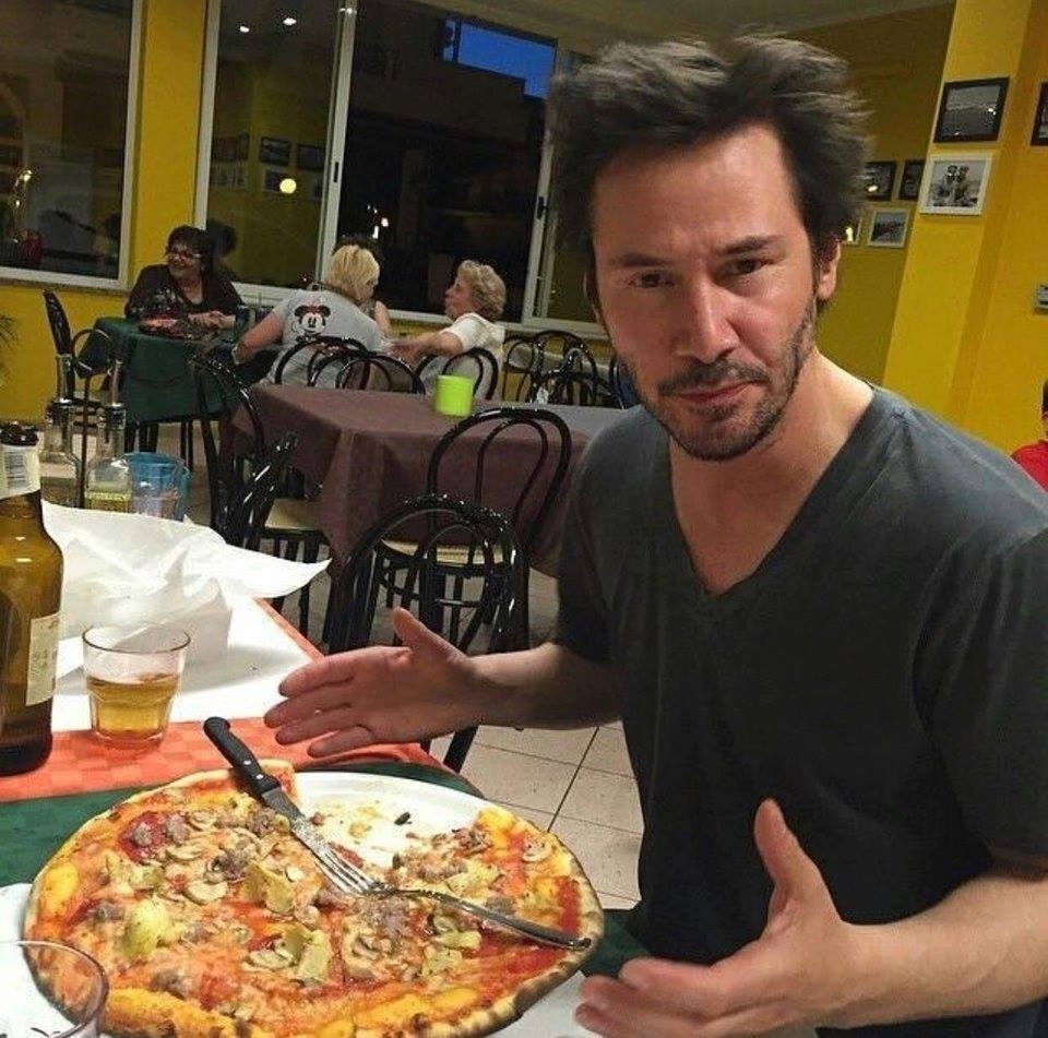 Buzznet - Just Keanu Reeves eating a full pizza with a... | Facebook