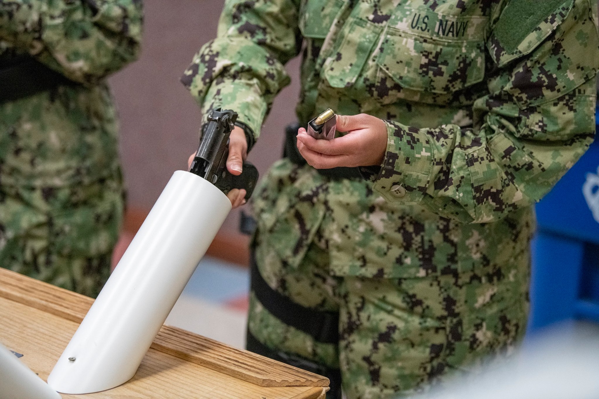 U.S. Navy Recruit Training Command - A recruit follows instruction for ...