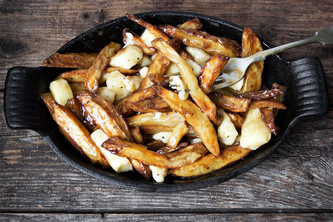 Happy National Poutine Day! We... - Cookbook Publishers