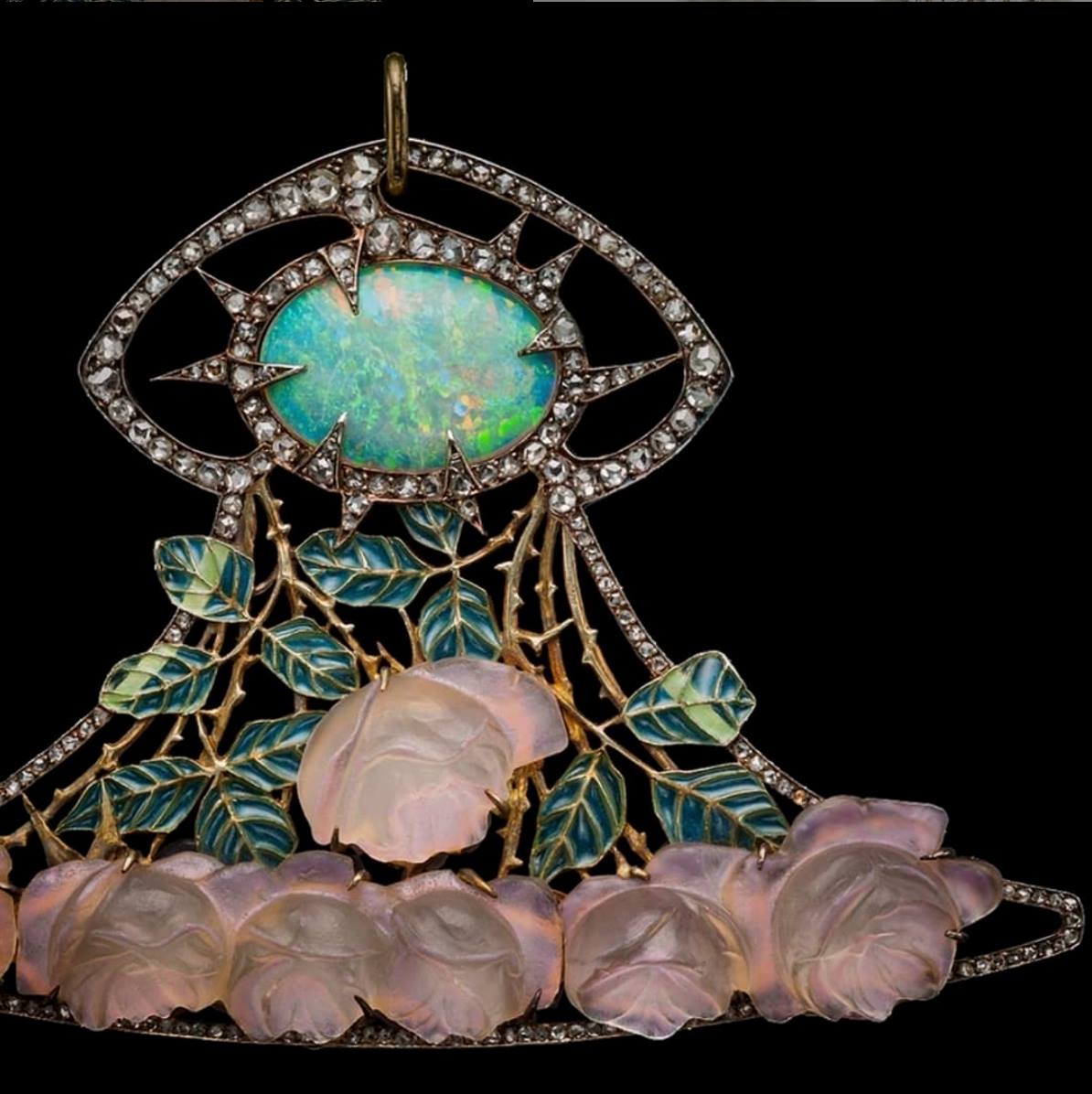 Rene Lalique's Woman's Face orchid pendant in opalescent glass