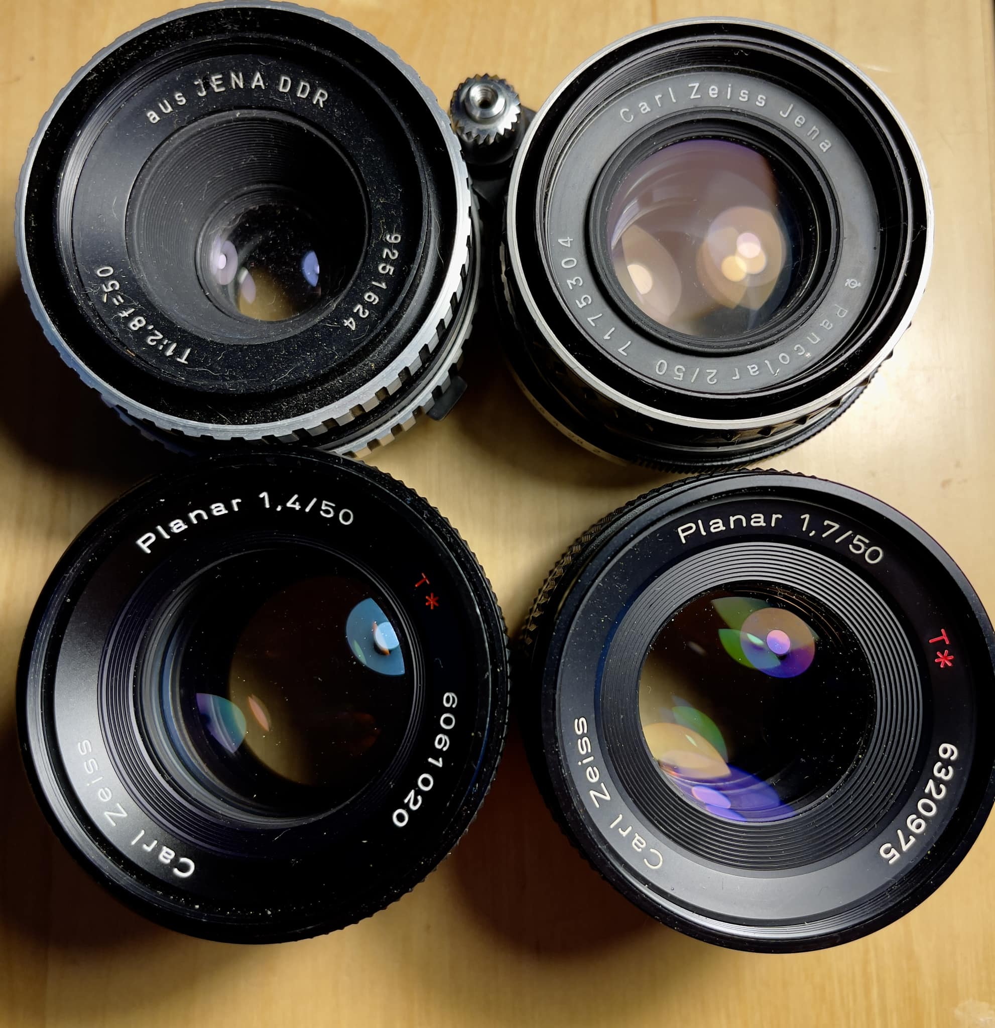 Is there any reason I should keep the Zeiss Planar f1.7 50mm when 