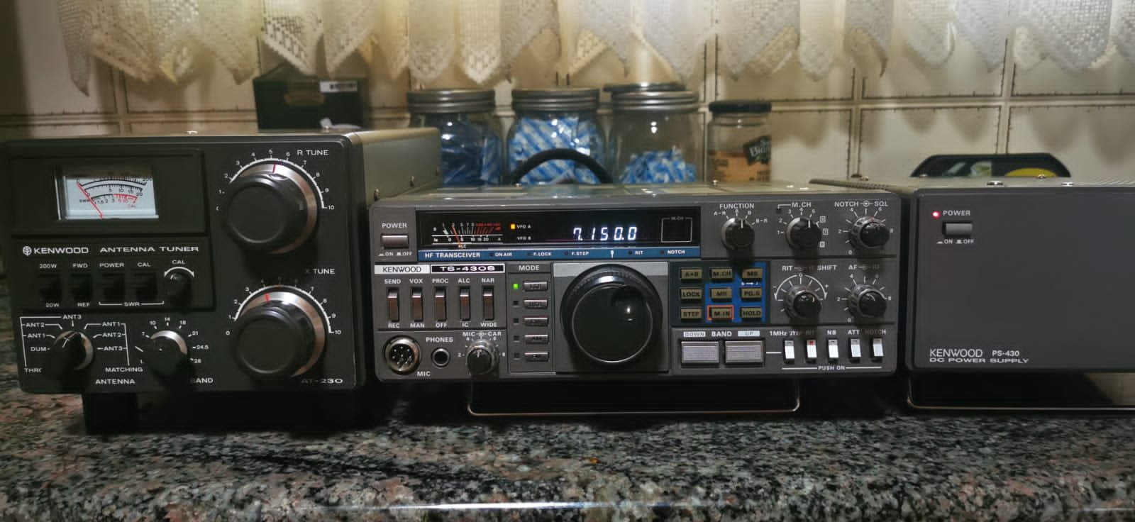 Vintage Kenwood TS-430S HF transceiver is a gray metal amateur
