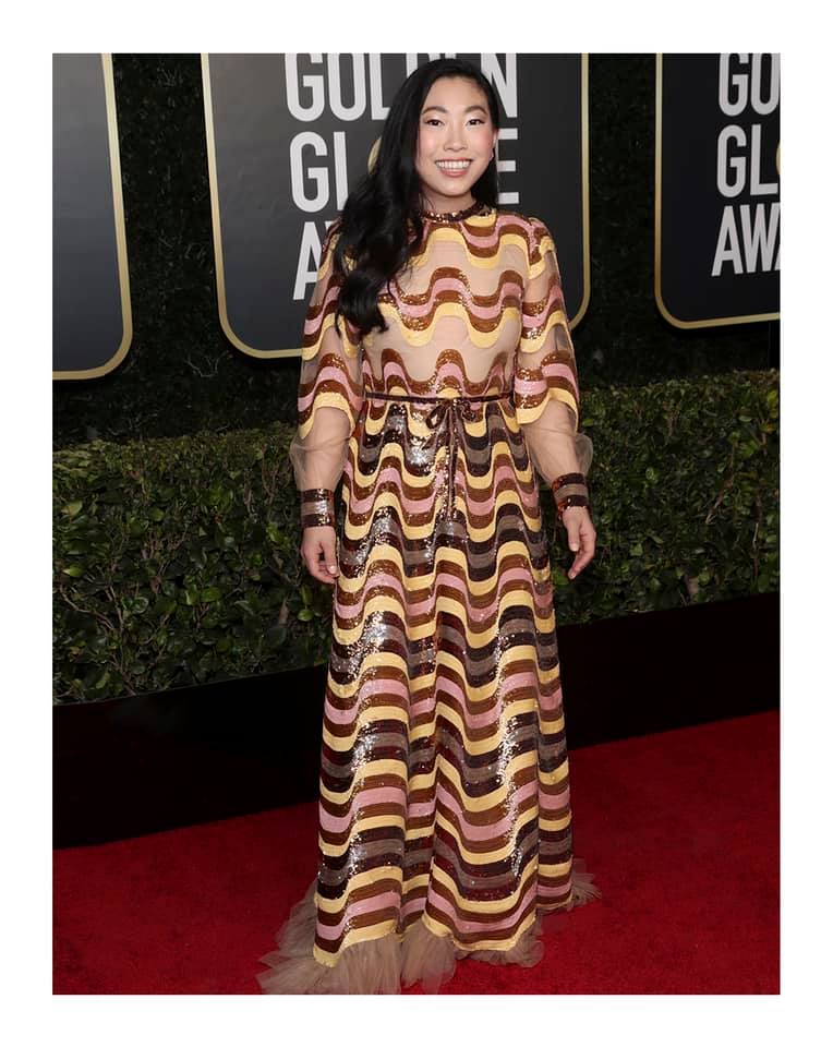 awkwafina gold dress attending the 2022 Met Gala to celebrate the opening of the Costume Institute's exhibit 'In America: An Anthology of Fashion.' For the event, Awkwafina wore a custom Gucci tulle puff sleeve week4525_20251102