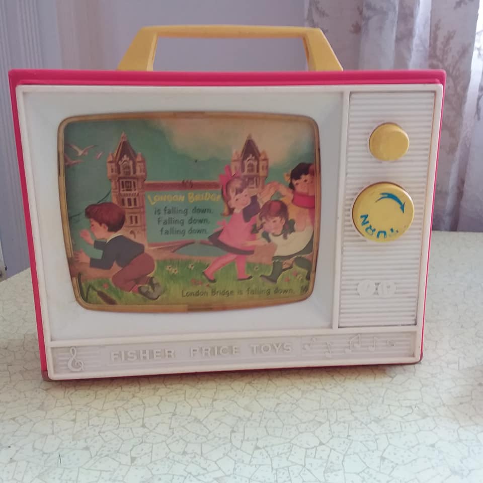 Fisher Price music box TV from the 60s. Complete wth Peek-a-boo screen