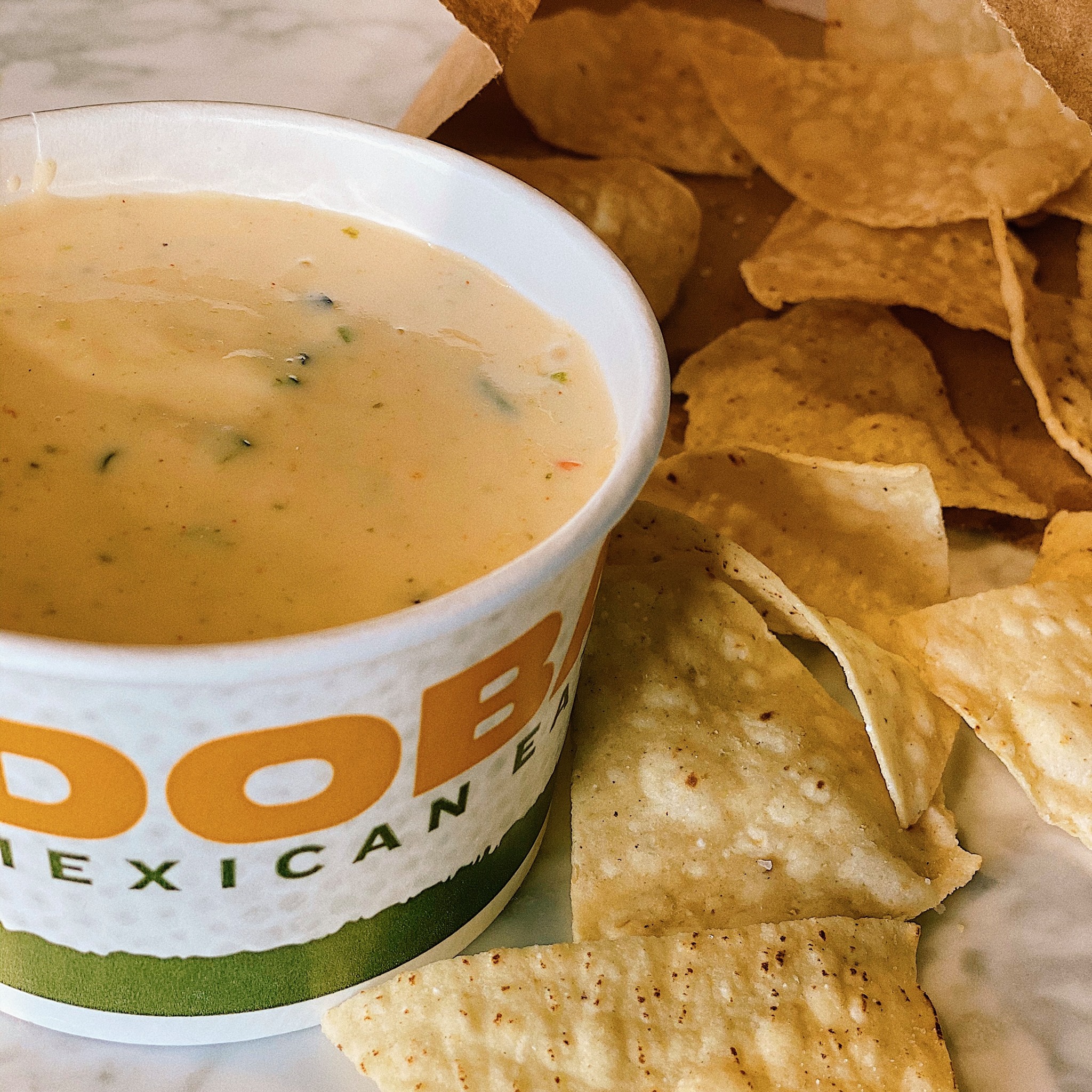 QDOBA - Something about freshly-made tortilla chips and 3-cheese queso