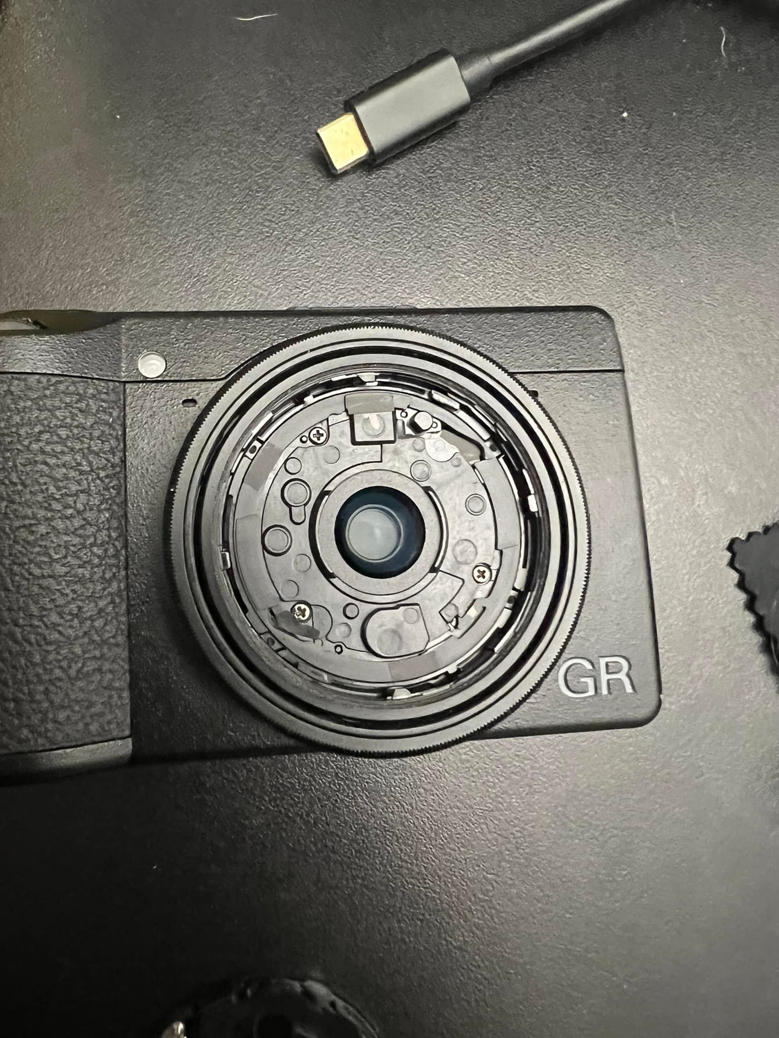 How to fix Ricoh GR 3 lens cover?