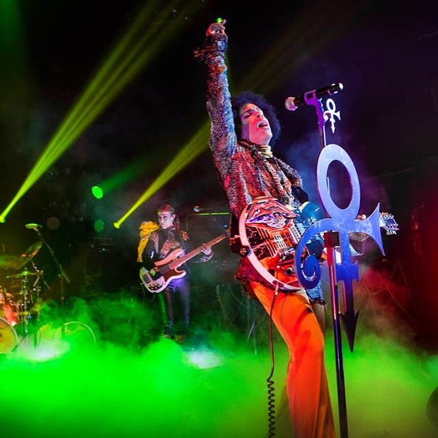 Prince takes the stage during the Piano & Microphone tour in 2016