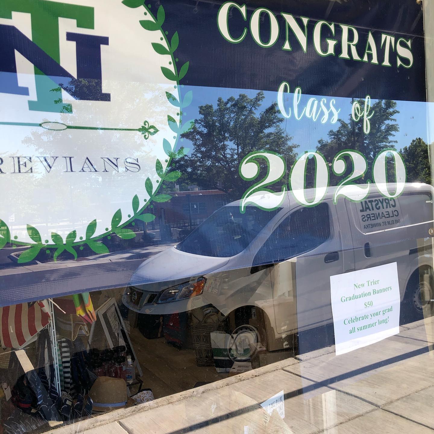 Ellen's on Elm - New Trier grad banners to hang all summer...