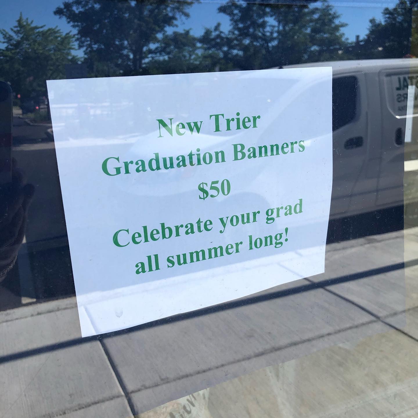 Ellen's on Elm - New Trier grad banners to hang all summer...