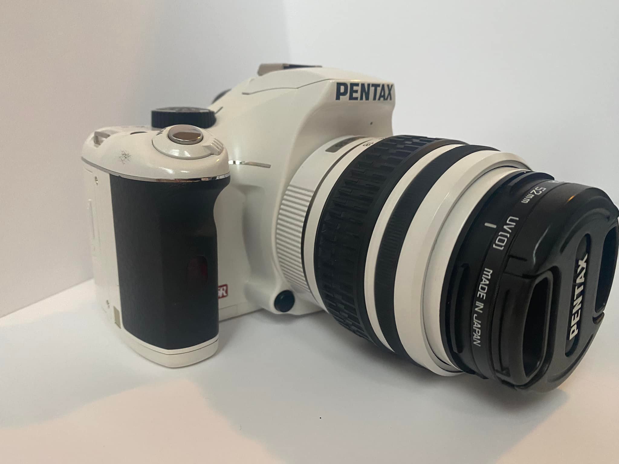 It's a pentax k100d 6.1mp digital slr camera with an 18-55mm, I