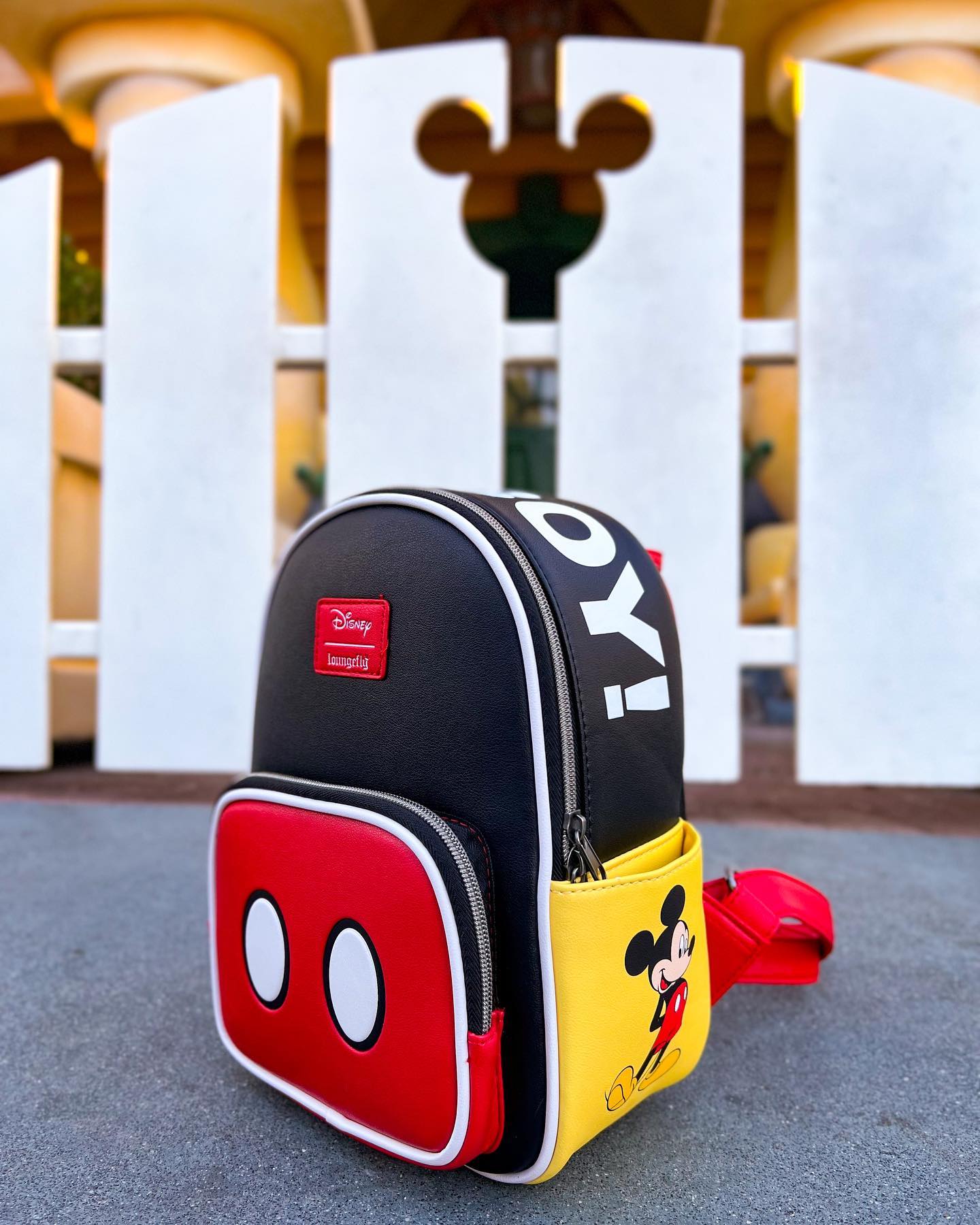 Mickey Mouse goes back to basics on this denim mini backpack