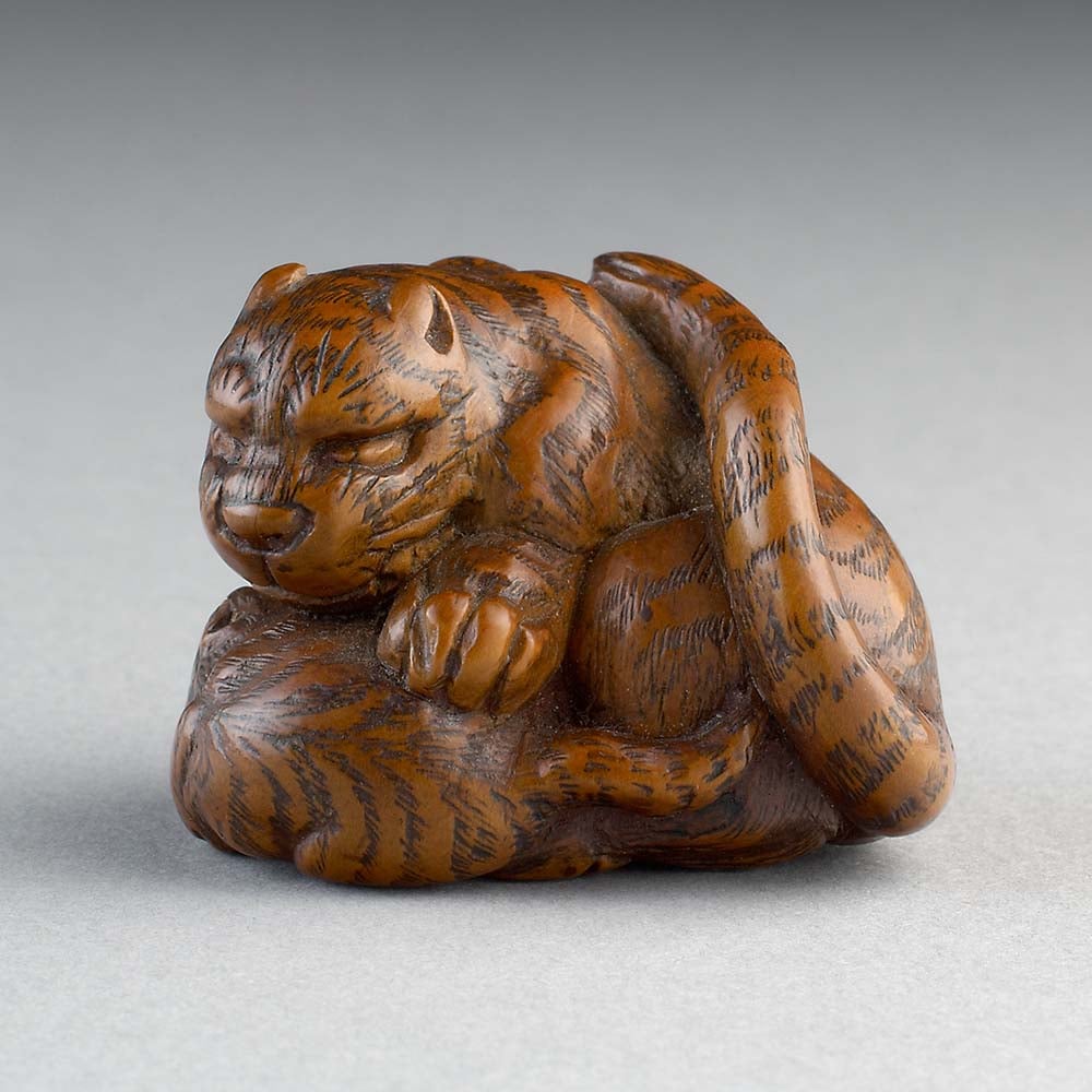 This Japanese tiger netsuke dates to the Edo period (1615–1868)—a