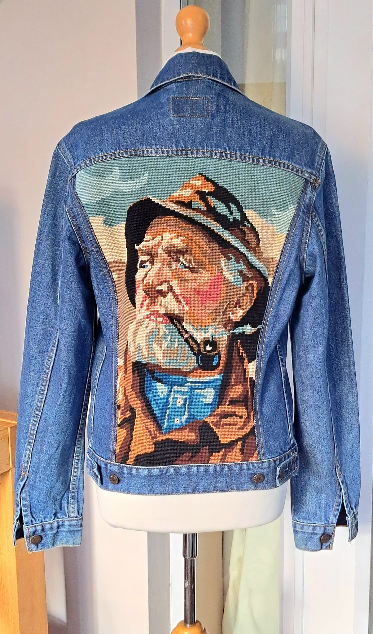 I upcycle denim jackets by adding vintage tapestries to the back 