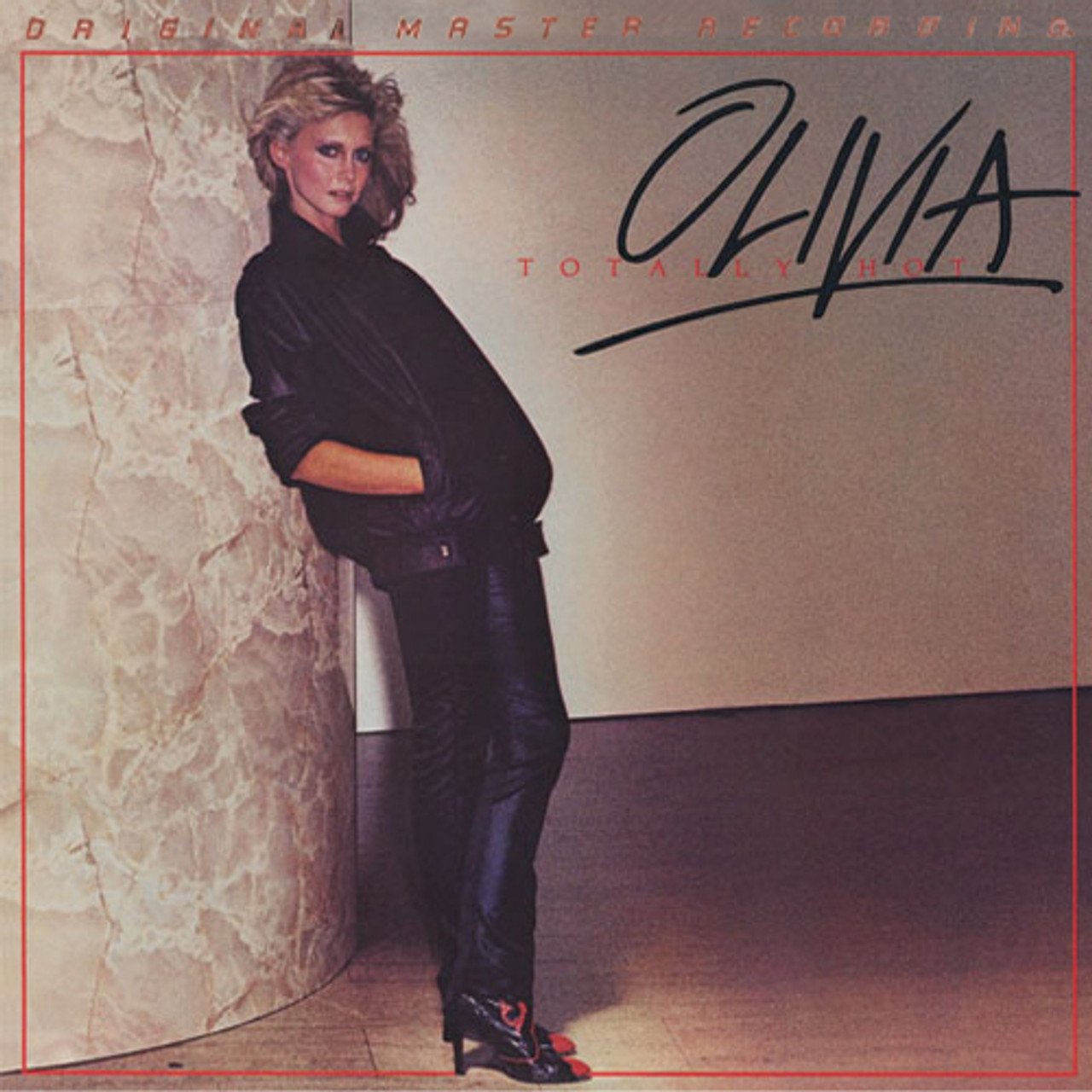 Olivia Newton-John's Totally Hot 45th anniversary coral red vinyl
