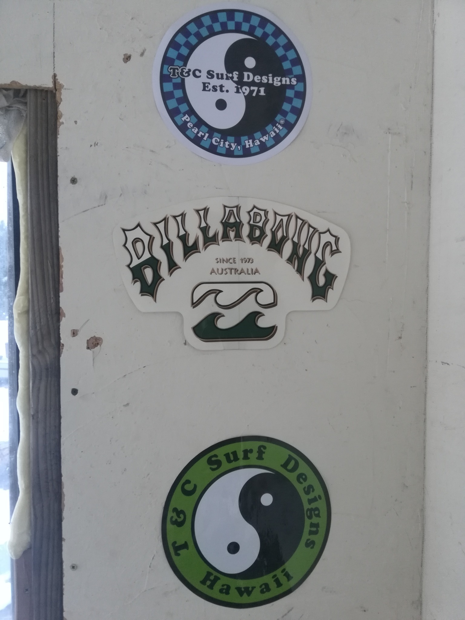 Vintage surf stickers on surfskate